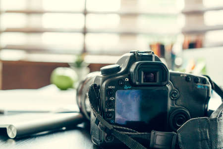 Working table of a photographer close upの写真素材