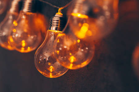 Garland of light bulb lamps in the darkの写真素材