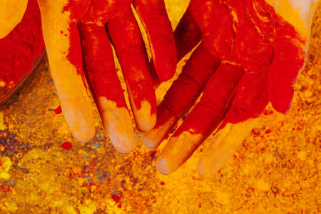 Hands holding Holi powder paint, view from aboveの写真素材