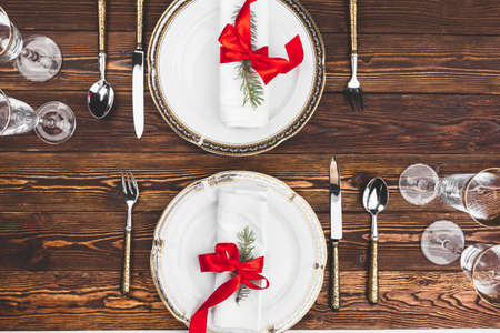 Brown wooden table with beautiful Christmas table settingの写真素材