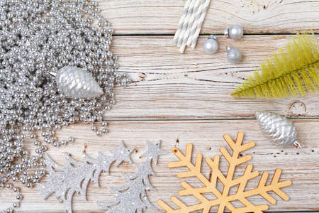 Christmas holiday decorations flatlay on light wooden background
