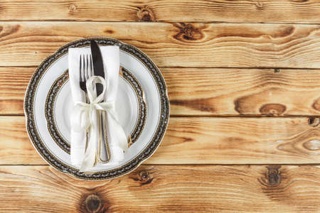Beautiful table setting on wooden table from above