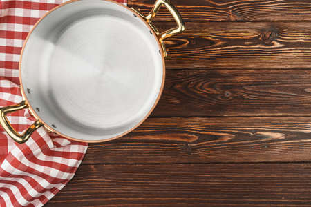 Top view of copper cooking pot on kitchen tableの写真素材