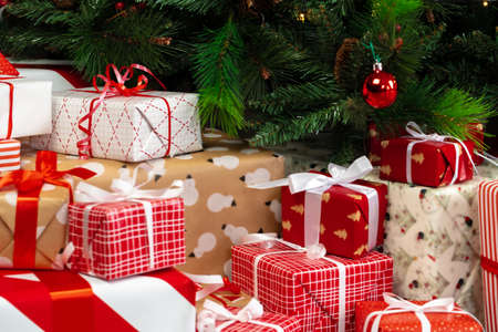 Pile of wrapped presents under the Christmas tree