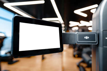 Close up of white screen on gym apparatus in a luxury gymの写真素材