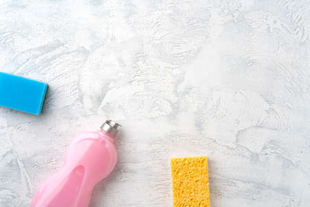 Home cleaning supplies on white wooden background, top viewの写真素材