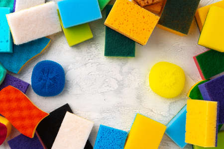 Pile of colorful cleaning sponges on gray backgroundの写真素材