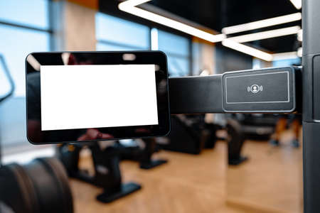 Close up of white screen on gym apparatus in a luxury gymの写真素材