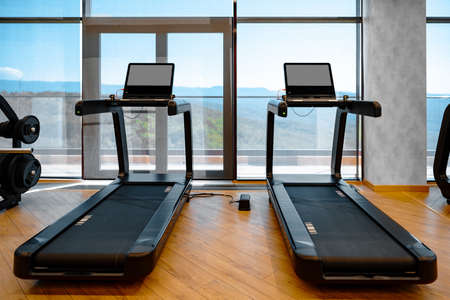 Studio shot of a professional treadmill in modern gymの写真素材