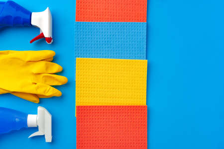 House cleaning supplies on blue color backgroundの写真素材