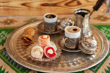 Turkish Coffee served with Turkish Delight on metal trayの写真素材