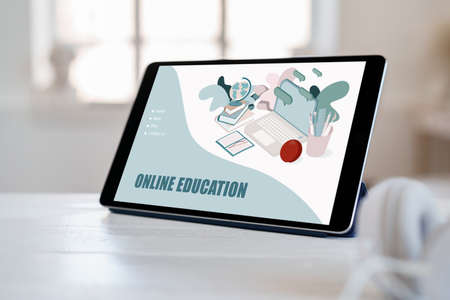 E-learning on digital tablet on white wooden tableの写真素材