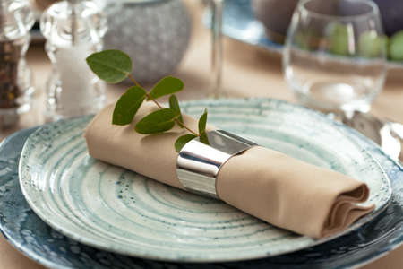 Stylish serving on a green ceramic plate with cotton napkin