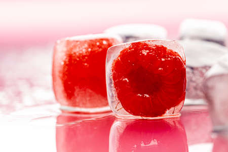 Berry ice cubes for decorating beverages close upの写真素材