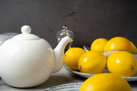 New ceramic dishware with several lemons for decoration