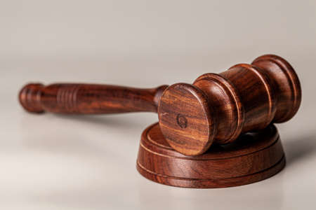 Wooden judges gavel on table close up