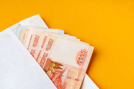 White envelope with heap of russian rubles close upの写真素材
