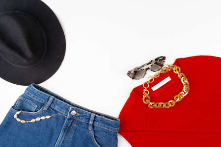 Woman outfit with red sweater and accessories on whiteの写真素材
