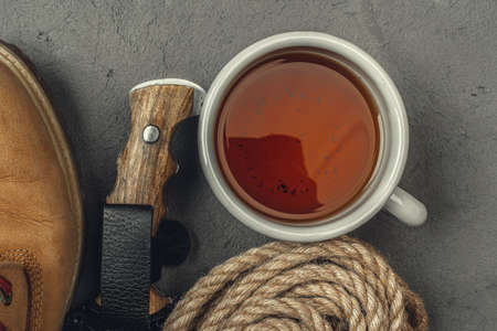 Hiking boots with travel accessories on grunge backgroundの写真素材