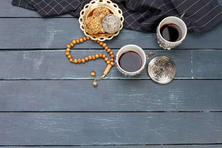 Nut balls dessert served with coffee on dark wooden table, top viewの写真素材