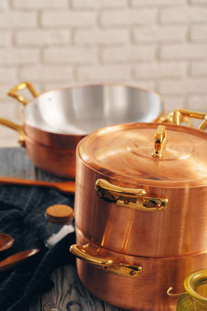 Close up of a set of copper cookwareの写真素材