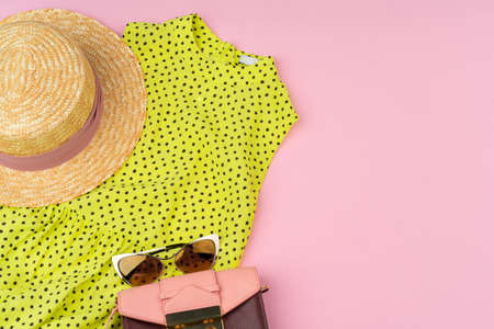 Stylish summer outfit for woman on pastel pink backgroundの写真素材