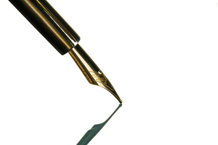 Vintage fountain pen close up on whiteの写真素材