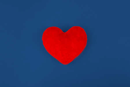 Red heart on color background. minimal concept.の写真素材