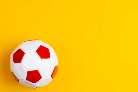 Red and white leather soccer ball, top viewの写真素材