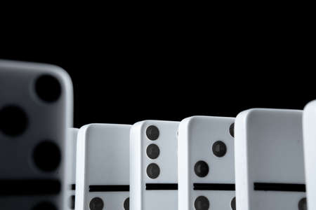 White dominoes in the dark close upの写真素材
