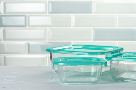 Set of plastic boxes kitchen ware on kitchen counterの写真素材