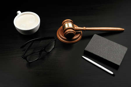 Image of wooden judge hammer on notepadの写真素材