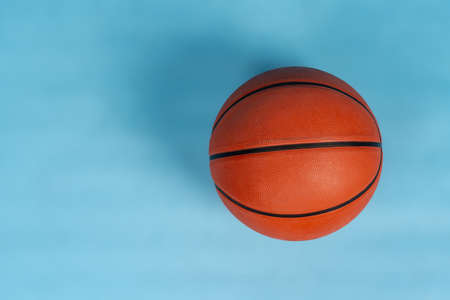 Ball for basket ball on an orange backgroundの写真素材
