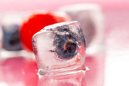Berry ice cubes for decorating beverages close upの写真素材
