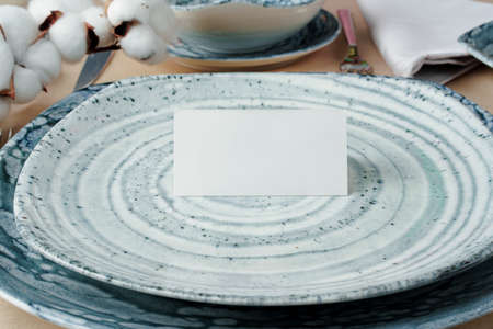 Beautiful table setting decorated with cotton budsの写真素材