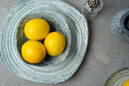 New ceramic dishware with several lemons for decorationの写真素材