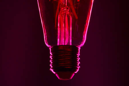 Light bulb on black background close up
