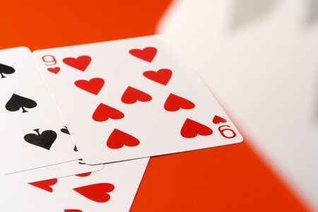 Playing cards on paper background close up