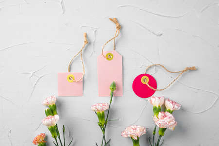 Flowers and blank paper tag. Sending flowersの写真素材