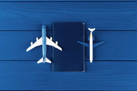 Toy plane on classic blue background, top view