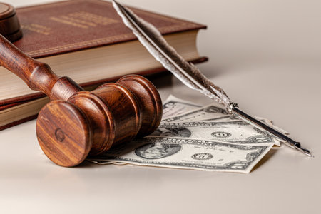 Law mallet and a stack of moneyの写真素材
