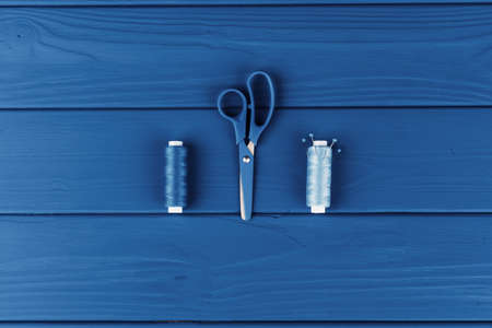 Tayloring accessories on classic blue background, top viewの写真素材