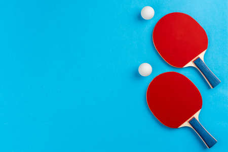 racket and ball on blue backgroundの写真素材