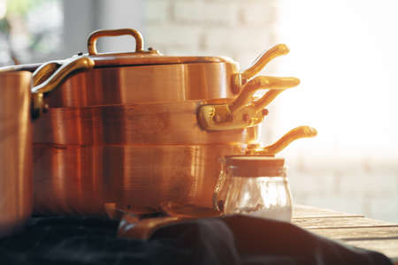 Close up of a set of copper cookware
