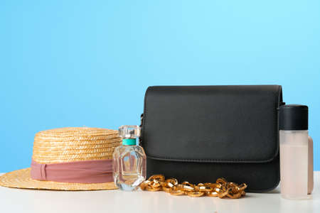 Female handbag with accessories flat lay top viewの写真素材