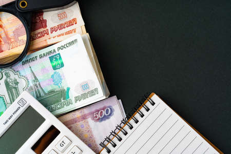 Close up photo of stack of Russian money rubles with calculator