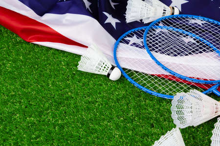 Badminton game rackets and shuttlecock on grassの写真素材