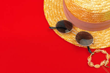 Female straw hat and sunglasses for beach holiday top viewの写真素材