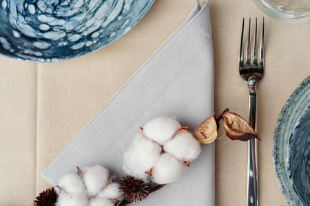 Beautiful table setting decorated with cotton buds