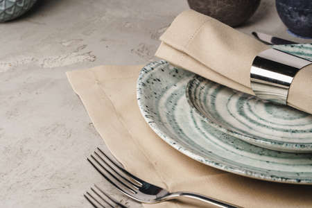 Ceramic stylish tableware set on grey background